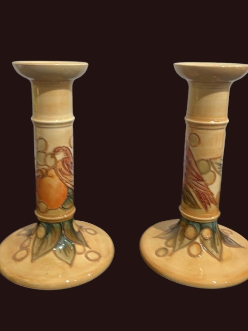 Two William Moorcroft  21cm Cream Candle Sticks with bird & fruit
